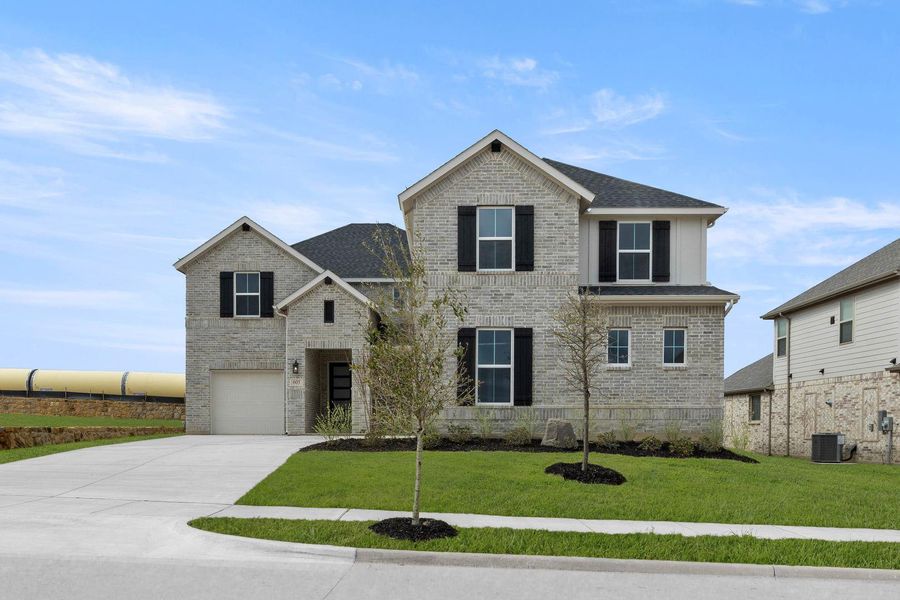 Front exterior of a new home in View at the Reserve, Mansfield, TX, highlighting curb appeal (Image 2). Front exterior of a new home in View at the Reserve, Mansfield, TX, highlighting curb appeal (Image 2).