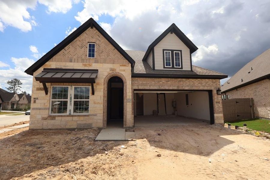 Exterior details and patio area of a home in ARTAVIA 45' Homesites, Conroe (Image 2).