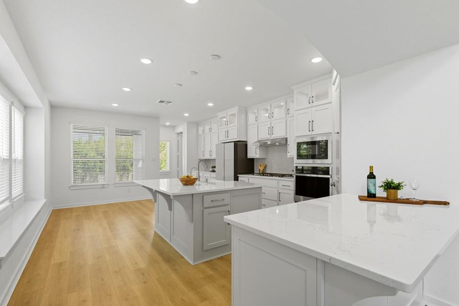 The island kitchen features Quartz counters. The island kitchen features Quartz counters.