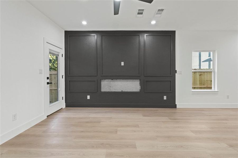 Spare room with light wood-type flooring, a ceiling fan, and recessed lighting Spare room with light wood-type flooring, a ceiling fan, and recessed lighting