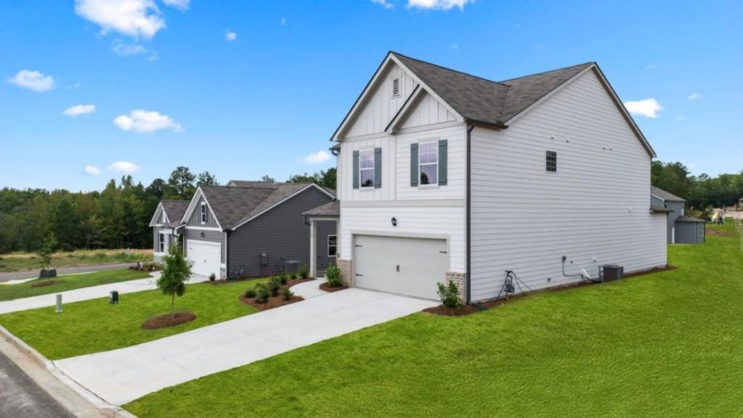 Front exterior of a new home in Sheffield Highlands, Dallas, GA, highlighting curb appeal (Image 2).