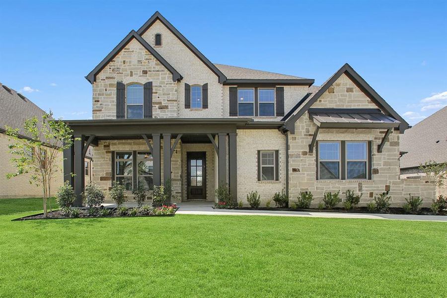 Front exterior of a new home in South Pointe Manor Series, Mansfield, TX, highlighting curb appeal (Image 2).