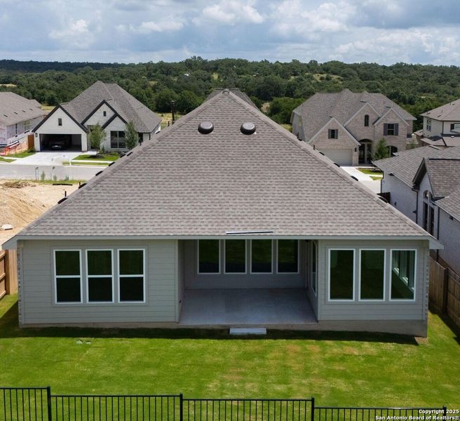 Front exterior of a new home in Meyer Ranch, New Braunfels, TX, highlighting curb appeal (Image 1).