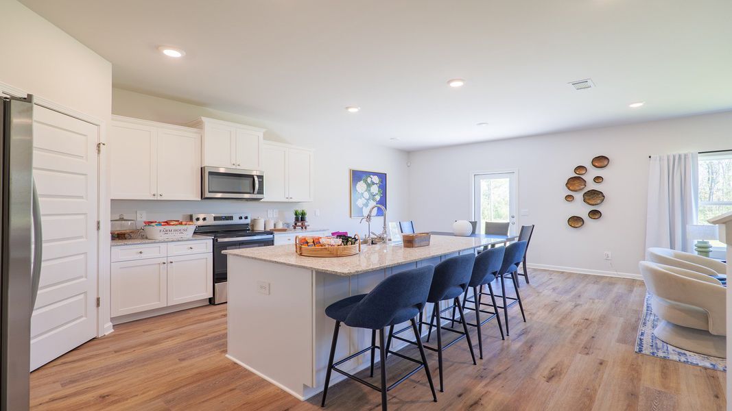 Representative furnished interior of a home built from the The Carol by D.R. Horton in Misting Springs, Crawfordville (Image 5).