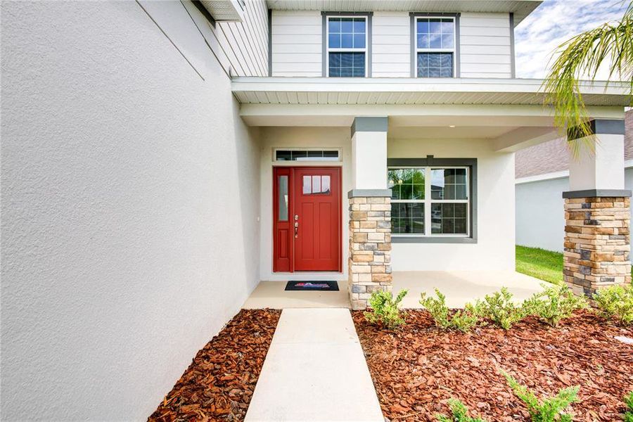 Front exterior of a new home in Aviary at Rutland Ranch, Parrish, FL, highlighting curb appeal (Image 2).