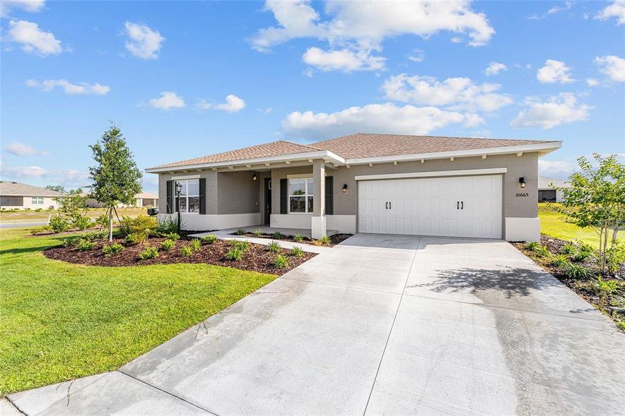 Front exterior of a new home in , Ocala, FL, highlighting curb appeal (Image 2). Front exterior of a new home in , Ocala, FL, highlighting curb appeal (Image 2).