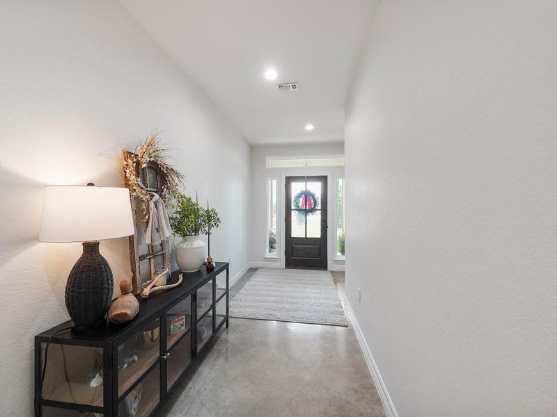 THE VIEW OF THE FRONT ENTRY FOYER