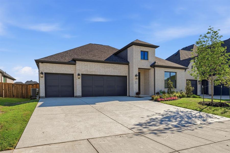 Front exterior of a new home in Quail Hollow, Rockwall, TX, highlighting curb appeal (Image 1). Front exterior of a new home in Quail Hollow, Rockwall, TX, highlighting curb appeal (Image 1).