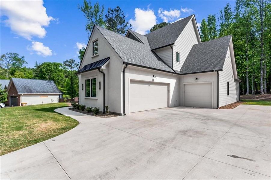Front exterior of a new home in , Hoschton, GA, highlighting curb appeal (Image 22). Front exterior of a new home in , Hoschton, GA, highlighting curb appeal (Image 22).