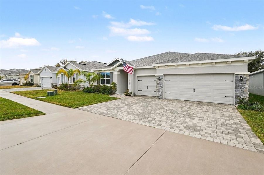 Front exterior of a new home in Willow Reserve, Lutz, FL, highlighting curb appeal (Image 22).
