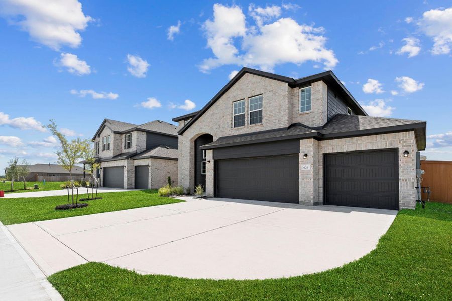 Expansive driveway and immaculate brick elevation, set in a vibrant resort-style community just minutes from local amenities.