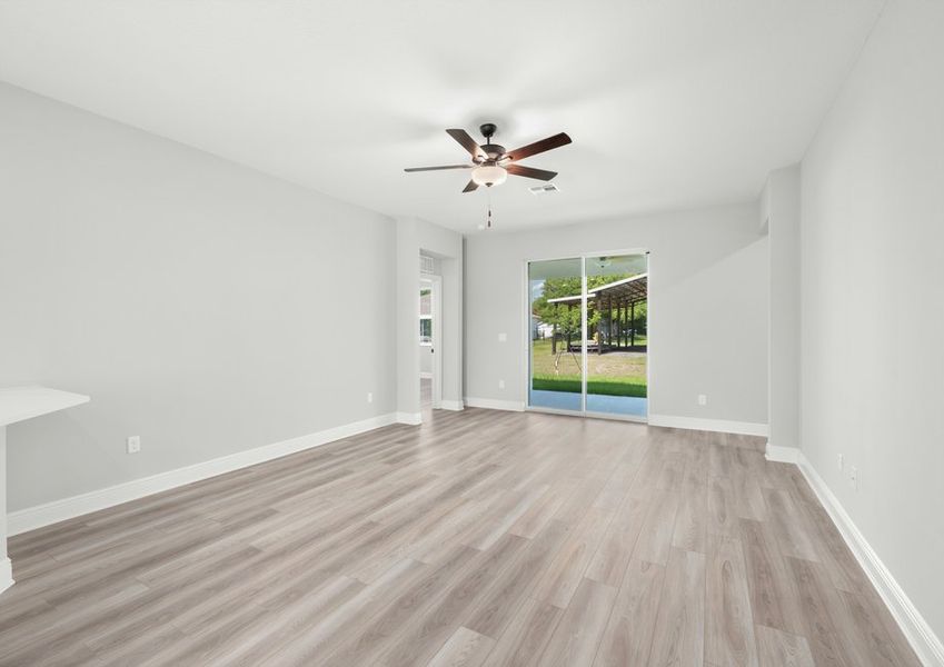 The living room flows seamlessly to the back patio