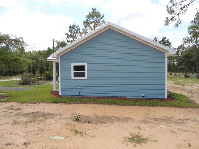 Exterior details and patio area of a home in , Williston (Image 13). Exterior details and patio area of a home in , Williston (Image 13).