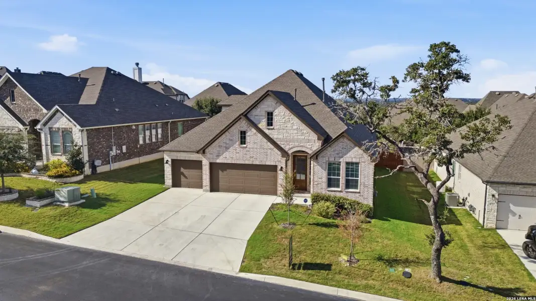 Front exterior of a new home in Front Gate at Fair Oaks Ranch 70, Fair Oaks Ranch, TX, highlighting curb appeal (Image 1). Front exterior of a new home in Front Gate at Fair Oaks Ranch 70, Fair Oaks Ranch, TX, highlighting curb appeal (Image 1).