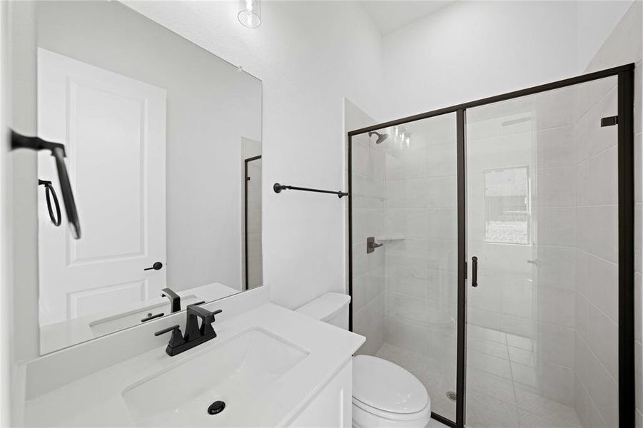 Full bath with vanity and a stall shower Full bath with vanity and a stall shower