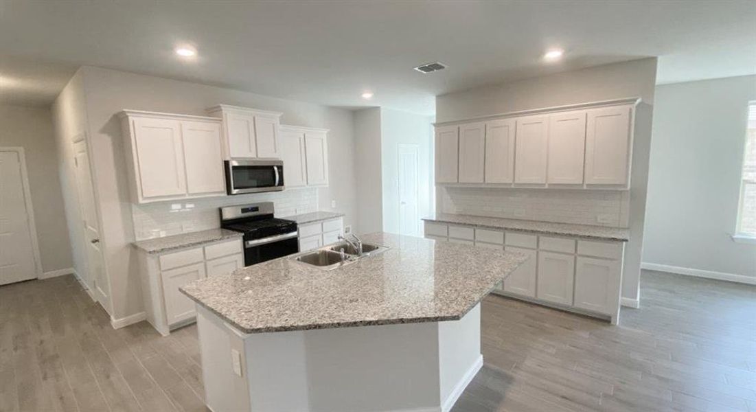 Kitchen- All Home and community information, including pricing, included features, terms, availability and amenities, are subject to change at any time without notice or obligation. All Drawings, pictures, photographs, video, square footages, floor plans, elevations, features, colors and sizes are approximate for illustration purposes only and will vary from the homes as built.