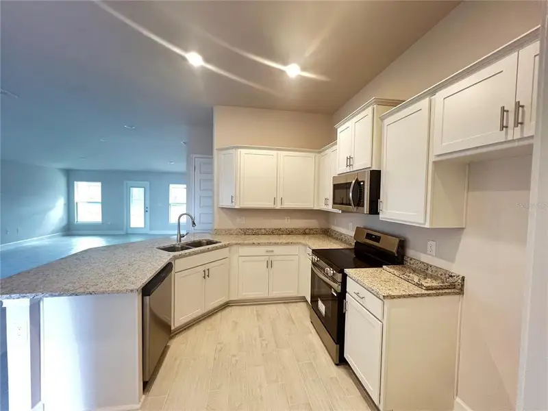 Furnished interior view inside a new home in , Dade City (Image 4).