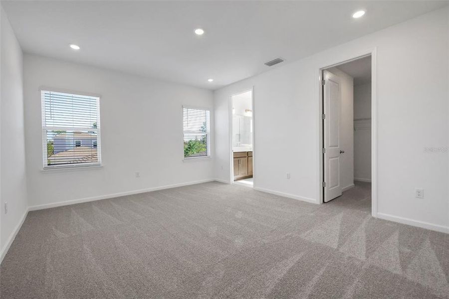 Spacious, unfurnished interior of a new home in Serenade at Ovation, Winter Garden (Image 25).