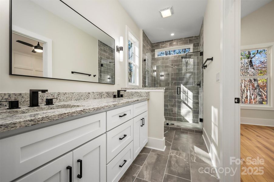 Granite, tile floors and custom shower