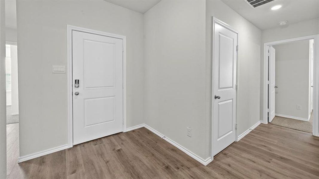 Entrance foyer featuring light wood-type flooring and recessed lighting