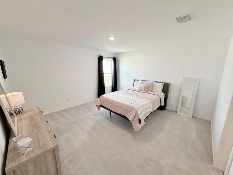 The master bedroom enjoys a private location in a rear corner of the home. The master bedroom enjoys a private location in a rear corner of the home.