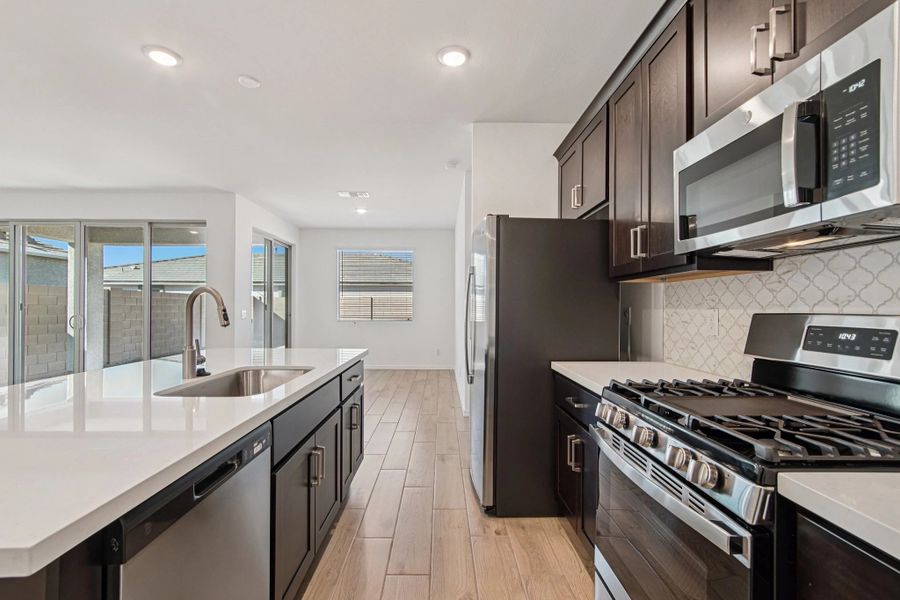 Kitchen featuring the Roosevelt Collection. Not actual home, finishes may vary by community.