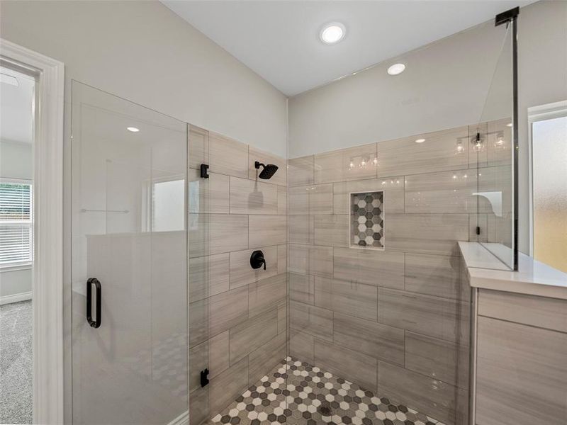 Full bath with a shower stall and recessed lighting Full bath with a shower stall and recessed lighting
