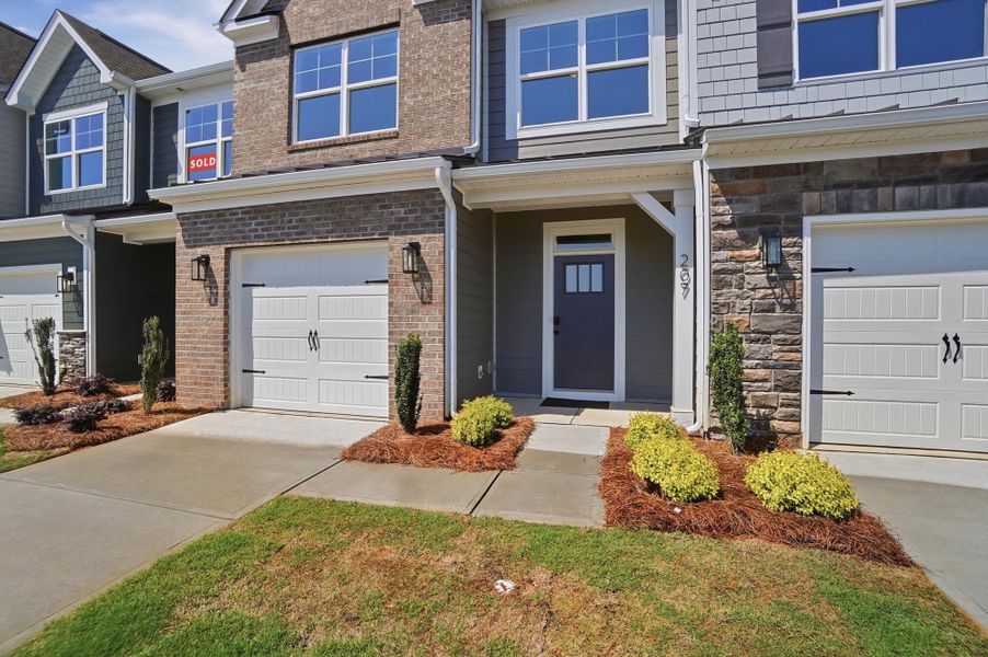Exterior details and patio area of a home in Blythe Mill Townhomes, Waxhaw (Image 2).
