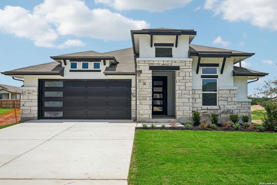 Front exterior of a new home in Veranda, San Antonio, TX, highlighting curb appeal (Image 1). Front exterior of a new home in Veranda, San Antonio, TX, highlighting curb appeal (Image 1).