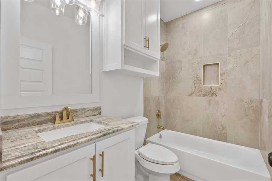 Bathroom featuring shower / washtub combination and vanity
