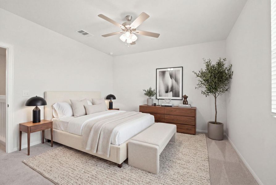 Soft carpet and clean walls create a serene retreat in this modern bedroom.