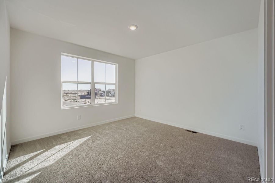 Spacious, unfurnished interior of a new home in Percheron: The Explorer Collection, Colorado Springs (Image 10).