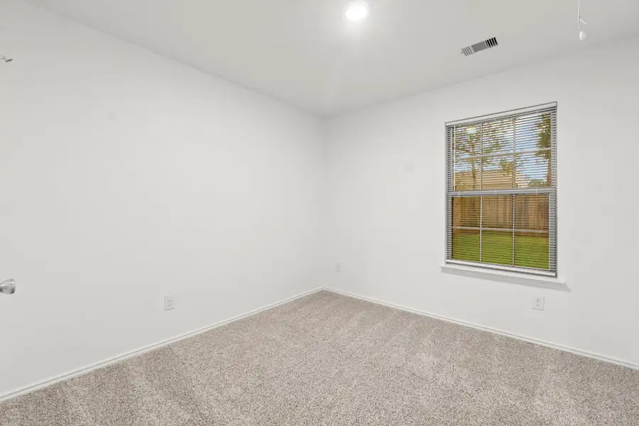 This secondary bedroom has great recessed lighting and offers great views of the backyard. This secondary bedroom has great recessed lighting and offers great views of the backyard.