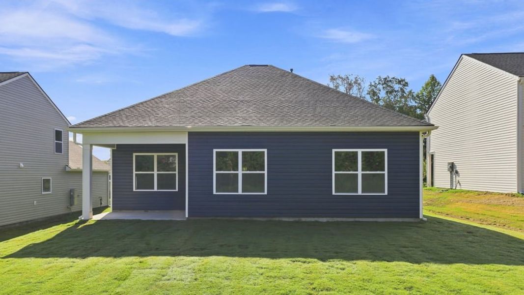 Exterior details and patio area of a home in Durbin Meadows Traditions, Fountain Inn (Image 3).