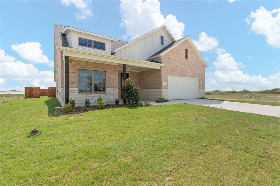 Front exterior of a new home in , Venus, TX, highlighting curb appeal (Image 20).