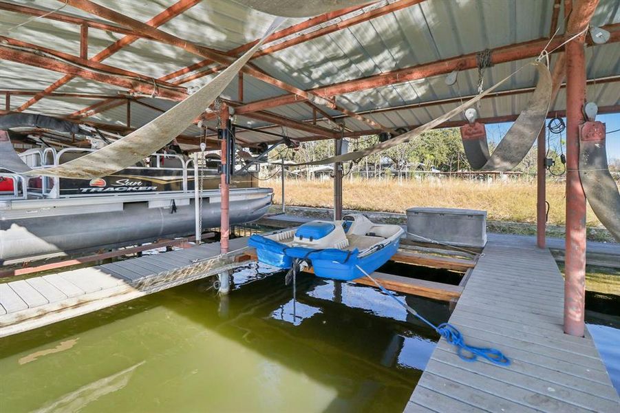 Your dedicated covered boat slip with lift and elec. Your dedicated covered boat slip with lift and elec.