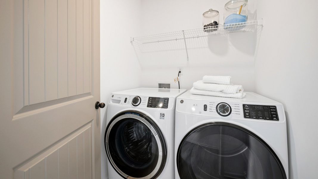 Dedicated laundry space with ventilated shelf Dedicated laundry space with ventilated shelf