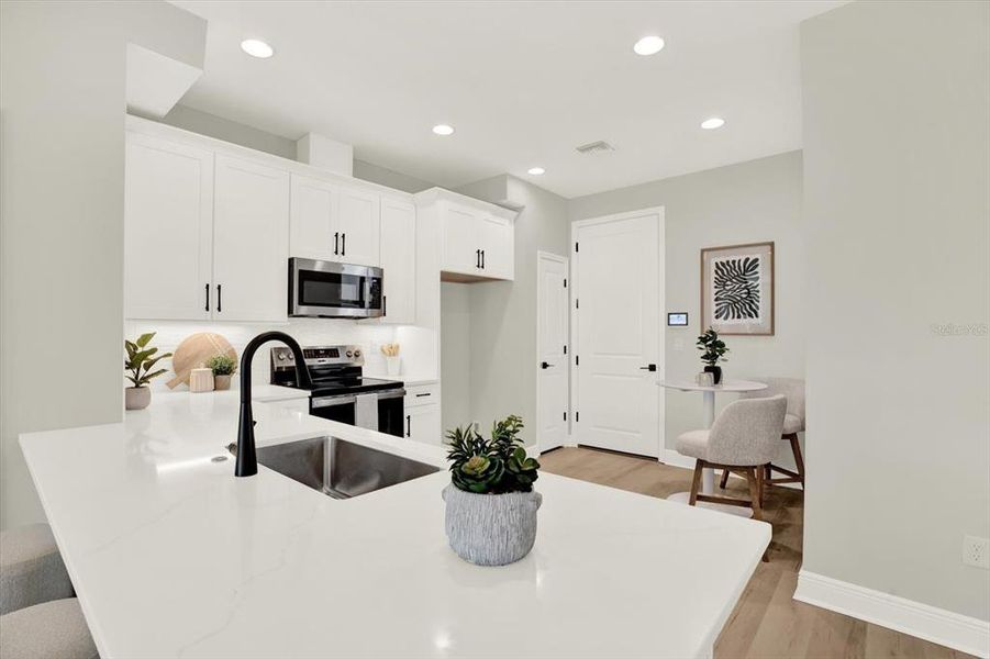 Furnished interior view inside a new home in The Towns At Long Bayou, Seminole (Image 25). Furnished interior view inside a new home in The Towns At Long Bayou, Seminole (Image 25).