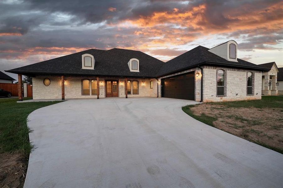 Front exterior of a new home in , Hideaway, TX, highlighting curb appeal (Image 2). Front exterior of a new home in , Hideaway, TX, highlighting curb appeal (Image 2).