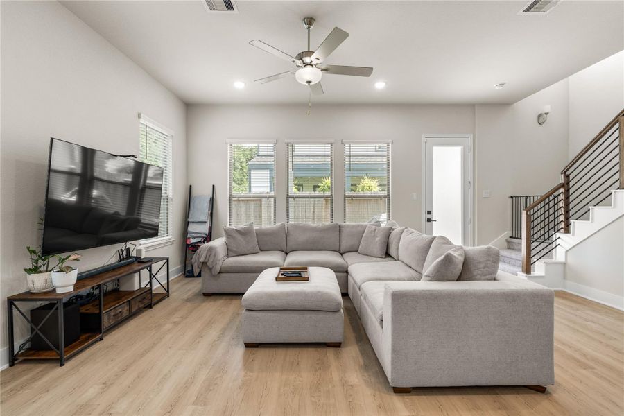 Generous proportions allow the living room to comfortably accommodate larger furnishings while preserving an open, uncluttered feel throughout the space.