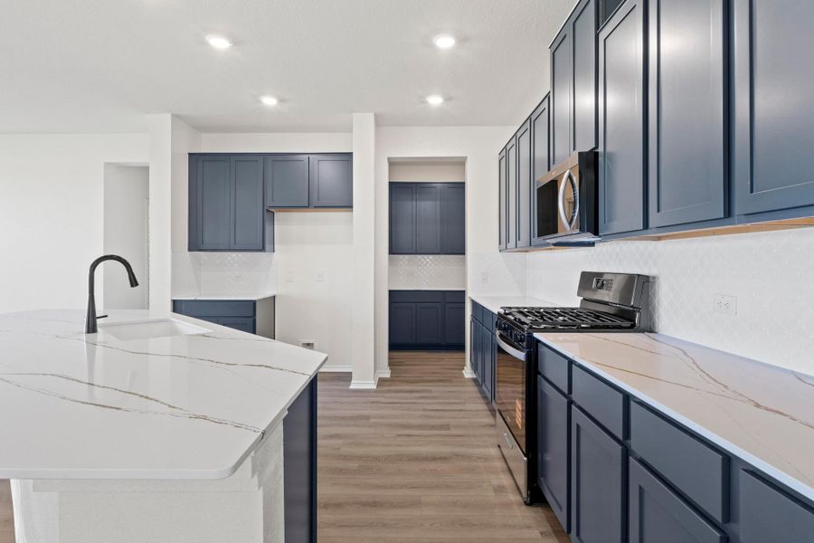 Furnished interior view inside a new home in Salerno - Classic Collection, Round Rock (Image 12). Furnished interior view inside a new home in Salerno - Classic Collection, Round Rock (Image 12).