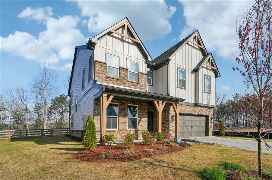 Front exterior of a new home in Tiberon Woods, Cumming, GA, highlighting curb appeal (Image 30). Front exterior of a new home in Tiberon Woods, Cumming, GA, highlighting curb appeal (Image 30).