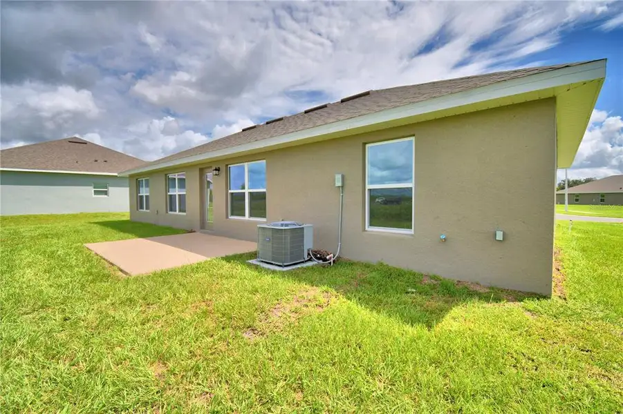 Exterior details and patio area of a home in Cadence Crossing, Auburndale (Image 3).