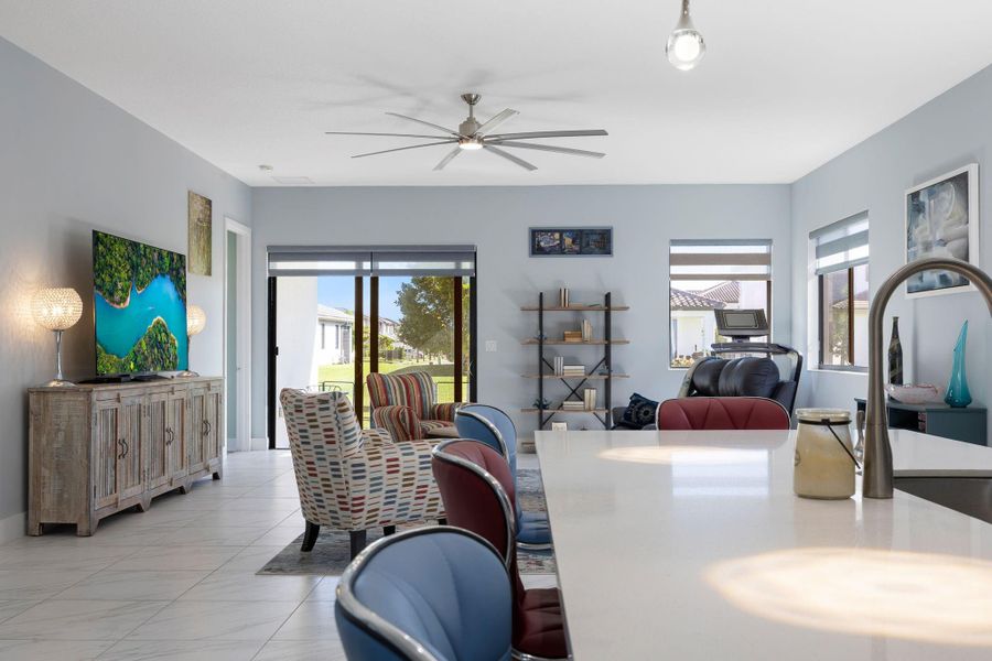 Dining room featuring healthy amount of natural light and ceiling fan