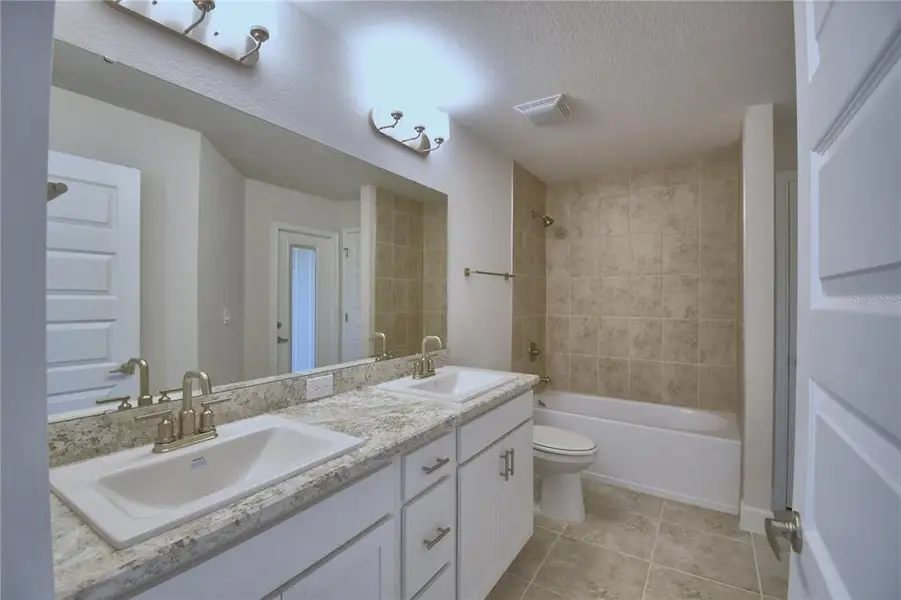 Furnished interior view inside a new home in Cadence Crossing, Auburndale (Image 16).