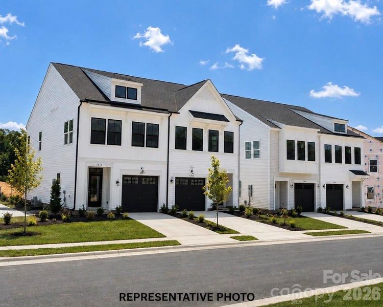 Front exterior of a new home in Ryder Park, Charlotte, NC, highlighting curb appeal (Image 14). Front exterior of a new home in Ryder Park, Charlotte, NC, highlighting curb appeal (Image 14).