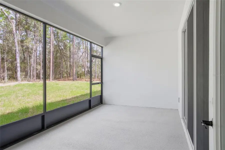 Exterior details and patio area of a home in , Ocala (Image 4).