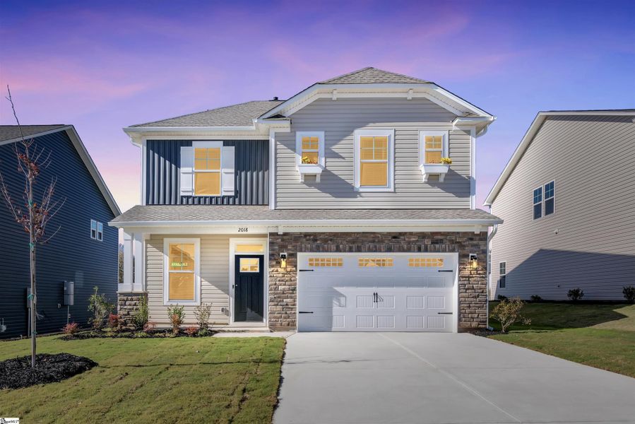 Front exterior of a new home in Halton Oaks, Spartanburg, SC, highlighting curb appeal (Image 1).