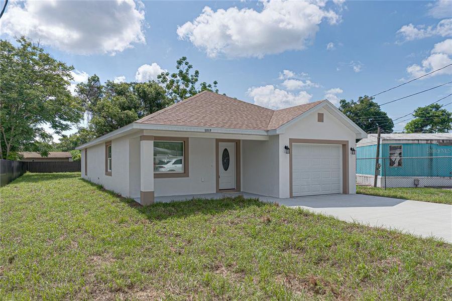 Front exterior of a new home in , Lakeland, FL, highlighting curb appeal (Image 18). Front exterior of a new home in , Lakeland, FL, highlighting curb appeal (Image 18).