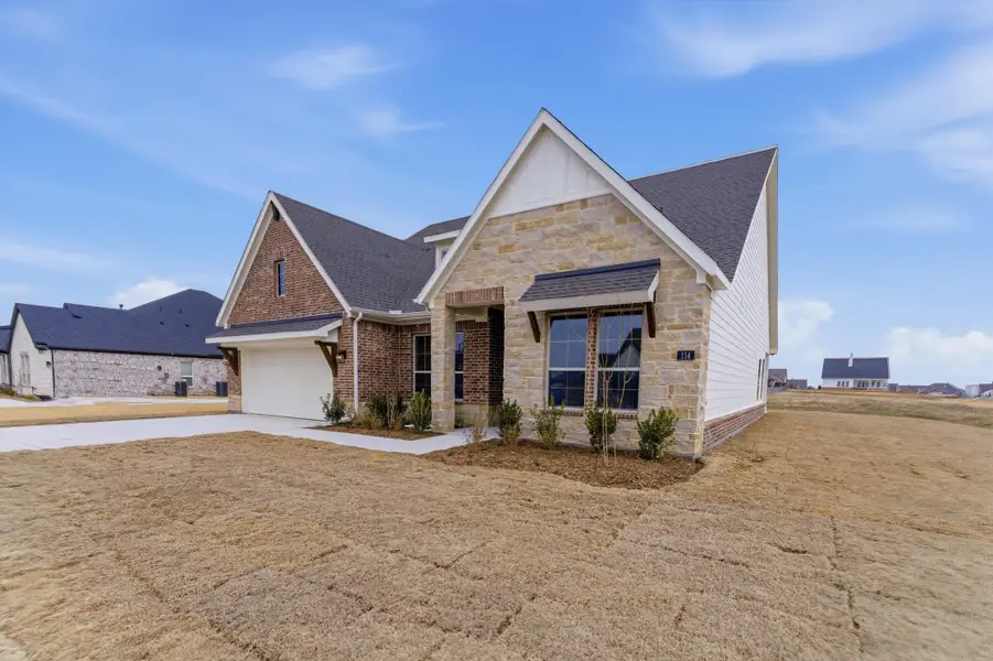 Front exterior of a new home in Fairview Meadows, New Fairview, TX, highlighting curb appeal (Image 16).